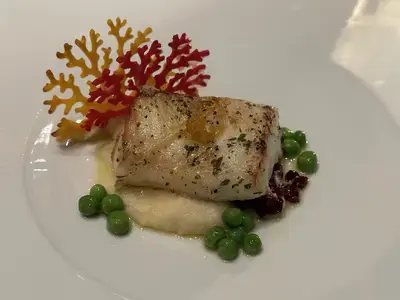 Icon of the Seas: the Icon of Vacations - Royal Caribbean 12 Empire Supper Club Seabass.jpeg